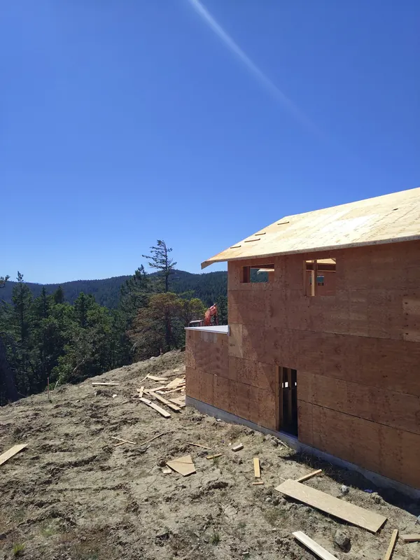 New build framing on a hillside lot with a view