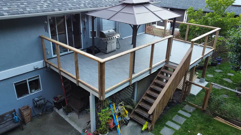 Aerial view of an elevated deck with cedar railing, gazebo and cedar stairs