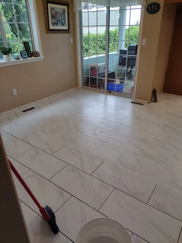 New large-format tile floor in a dining room