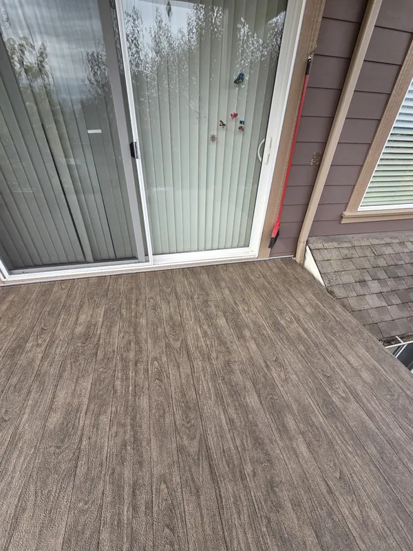 Brown wood-grain vinyl deck outside sliding glass doors