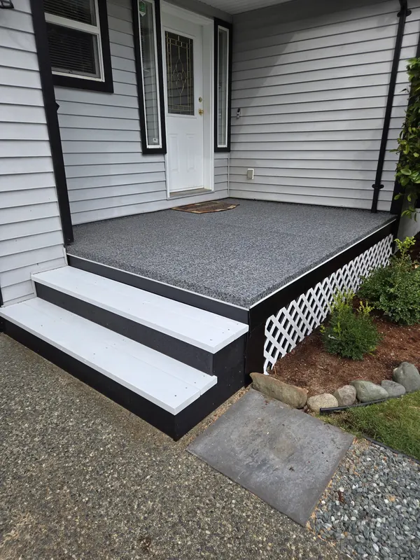 Granite-look vinyl front porch with white painted steps and a white lattice skirt